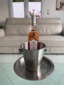 a bottle of whiskey in a bucket on a table at Cannes centre Villa piscine spa in Cannes +33 photos