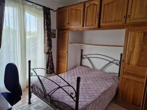 a bedroom with a canopy bed and a window at Villa Sambracitaine in Les Issambres +29 photos