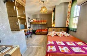 a small bedroom with a bed and a kitchen at Velespit Hotel in Antalya