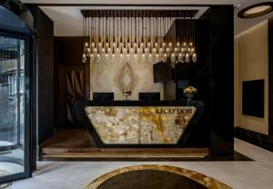 a lobby of a hotel with a reception desk at Gleam Bomonti Hotel in Istanbul