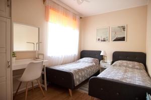 Postel nebo postele na pokoji v ubytování Ośrodek Wypoczynkowy Relaks i Apartamenty