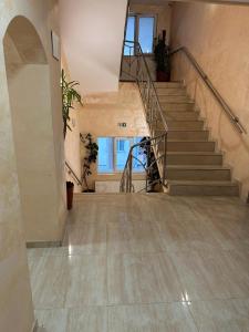 an empty hallway with stairs in a building at Pensiunea Balea in Cîmpeni