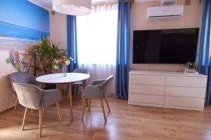 TV a/nebo společenská místnost v ubytování Ośrodek Wypoczynkowy Relaks i Apartamenty