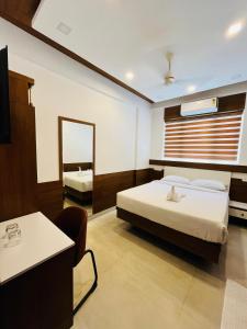 Welcome Hotels客房内的一张或多张床位