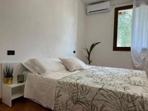 Postel nebo postele na pokoji v ubytování Villa Aurora in Erbusco-Franciacorta + 37 fotografií