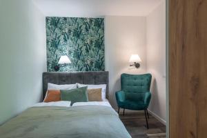 Кровать или кровати в номере VacationClub - Podgórzyńska 6A apartament 6