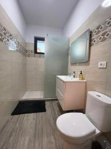 a bathroom with a toilet and a sink and a shower at Best View luxury in Costinesti