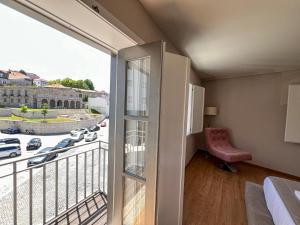 Postel nebo postele na pokoji v ubytování Casa do Solar by VinteOito