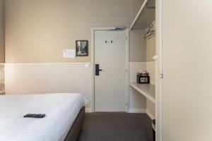 Postel nebo postele na pokoji v ubytování Hotel karel de stoute