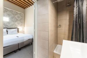 Postel nebo postele na pokoji v ubytování Hotel karel de stoute