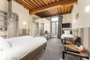 Postel nebo postele na pokoji v ubytování Hotel karel de stoute