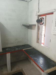 a small room with a table and a window at AP Houses in Chīrāla