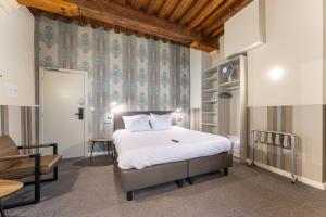 Postel nebo postele na pokoji v ubytování Hotel karel de stoute