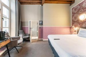 Postel nebo postele na pokoji v ubytování Hotel karel de stoute