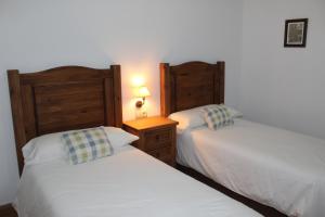 A bed or beds in a room at Casas rurales embalse del Cenajo