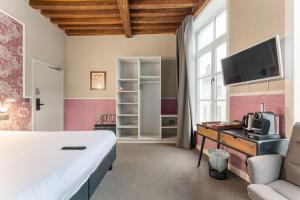 TV a/nebo společenská místnost v ubytování Hotel karel de stoute