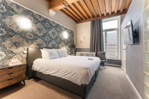 Postel nebo postele na pokoji v ubytování Hotel karel de stoute
