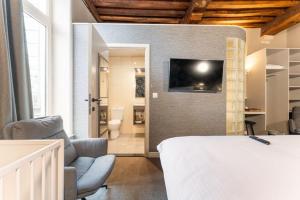 TV a/nebo společenská místnost v ubytování Hotel karel de stoute