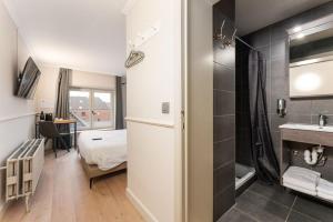 Postel nebo postele na pokoji v ubytování Hotel karel de stoute