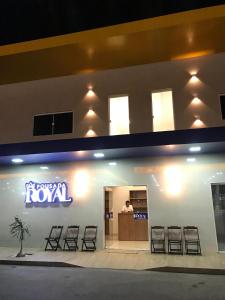 a hotel with a sign for a hotel room at Pousada Royal in Mossoró