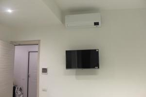 TV a/nebo společenská místnost v ubytování SG Rooms + 8 fotografií