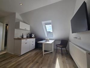 Photo de la galerie de l'établissement Apartments Zur Bauerndiele " Lüttje Stuuv", à Hage 14 autres photos