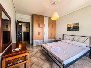 Postel nebo postele na pokoji v ubytování The Horizon Apartment