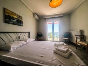 Postel nebo postele na pokoji v ubytování The Horizon Apartment