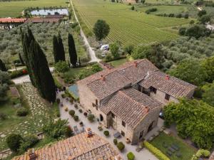 an aerial view of a large house with trees at Il Palazzo - Agriturismo, Winery in Arezzo