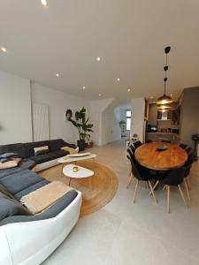 a living room with a couch and a table at Les amies in Blankenberge