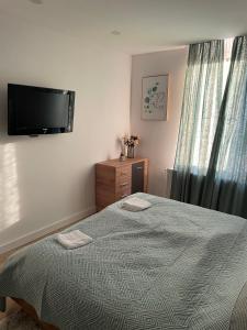 A bed or beds in a room at Péterfia Boutique Apartments