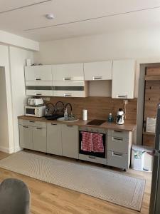 A kitchen or kitchenette at Péterfia Boutique Apartments