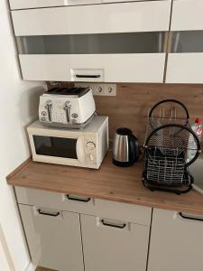 A kitchen or kitchenette at Péterfia Boutique Apartments