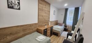 A bed or beds in a room at Péterfia Boutique Apartments