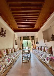 Letto o letti in una camera di Palmeraie 5 Vue Piscine et Jardin