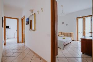 a large room with a bed and a bathroom at Il Giardino dei limoni in Polvica +17 photos