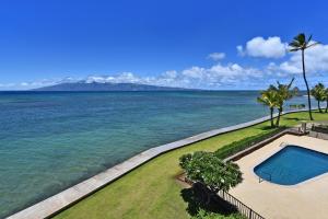 an aerial view of the ocean and a swimming pool at Tropical Hawaiian Oceanfront - indigomaui - KR210 in Kahana