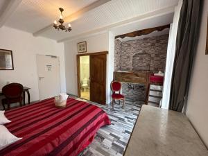Postel nebo postele na pokoji v ubytování L'hôtel du Bastier