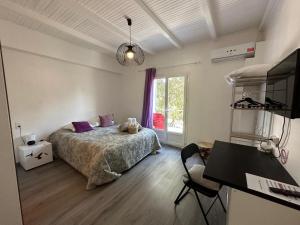Postel nebo postele na pokoji v ubytování L'hôtel du Bastier