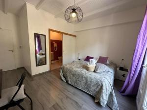 Postel nebo postele na pokoji v ubytování L'hôtel du Bastier