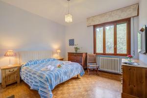 En eller flere senge i et værelse på Connie's Apartment - Happy Rentals