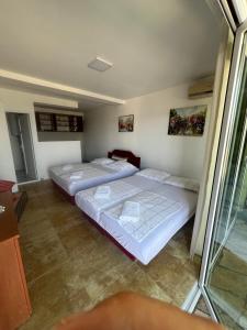 Postel nebo postele na pokoji v ubytování Apartments Bibic
