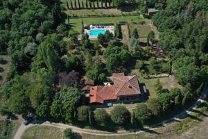an aerial view of a house with a swimming pool at Casale Tigli - Happy Rentals in Capolona
