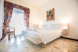 En eller flere senge i et værelse på Paradiso Al Mare shared pool - Happy Rentals