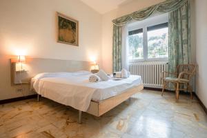 En eller flere senge i et værelse på Paradiso Al Mare shared pool - Happy Rentals