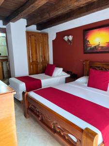 Voodi või voodid majutusasutuse Hotel Don Pedro De Heredia toas