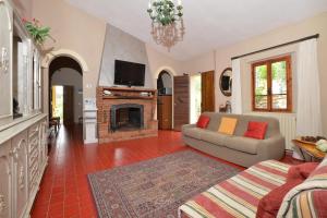 A television and/or entertainment centre at Casale Vittoria - Happy Rentals