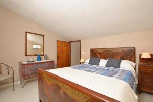 A bed or beds in a room at Casale Vittoria - Happy Rentals