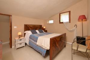A bed or beds in a room at Casale Vittoria - Happy Rentals