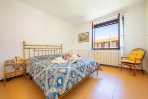 A bed or beds in a room at Appartamento Gaya Stresa Center - Happy Rentals